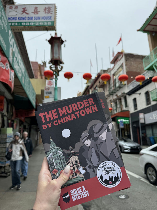 chinatown hand holding booklet