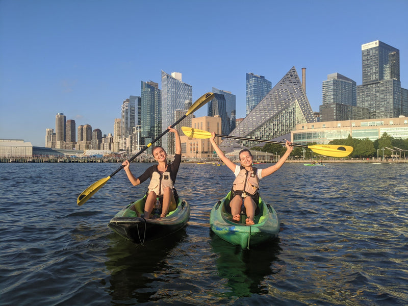kayakers-holding-paddles