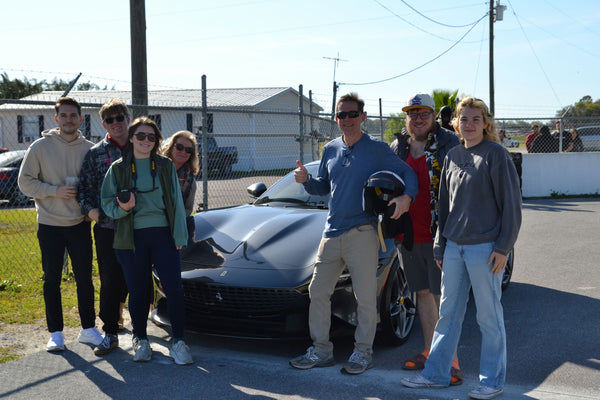 large family with sports car
