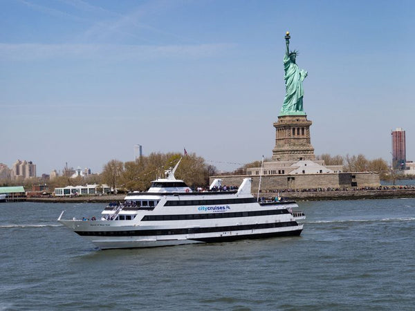lunch cruise with statute of liberty background
