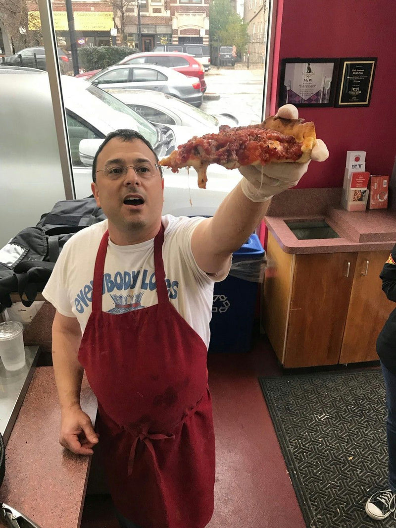 man-holding-a-pizza-slice