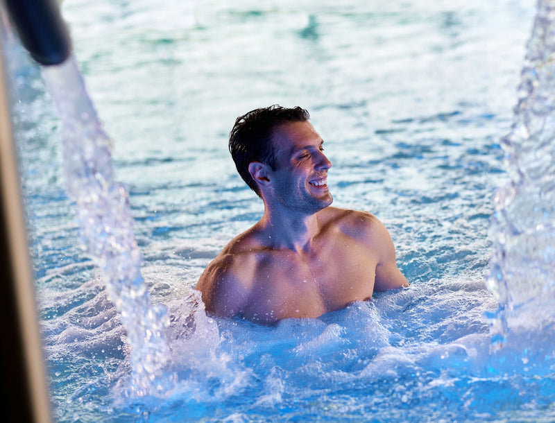 man in spa pool