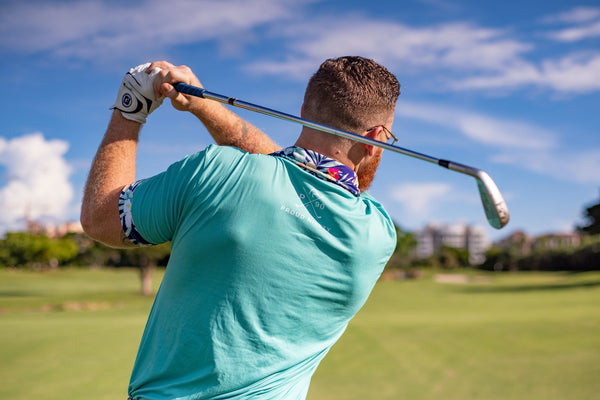 2 men on gold course putting