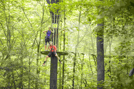 mother watches as son zip lines