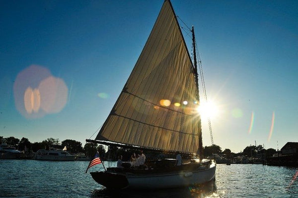 at sunset Sail Selina II St Michaels MD intimate gay wedding  sailing charters same sex boating chesapeake bay romantic sunset cruises champagne lesbian elopement packages LGBT engagement seaside wedding beach wedding coastal wedding.jpg