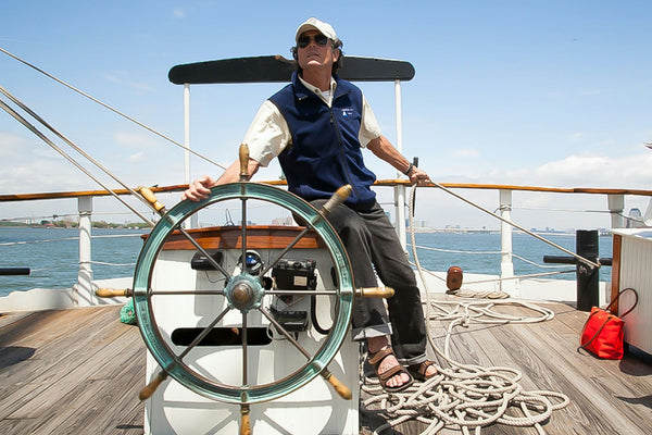 navigating-the-boat-with-a-wooden-wheel