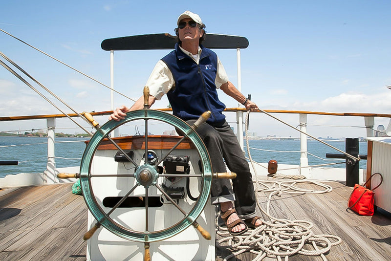 navigating-the-boat-with-a-wooden-wheel