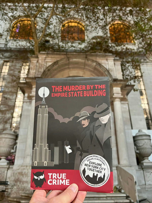 nyc hand holding booklet