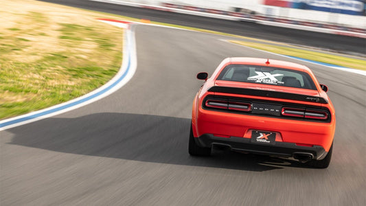 orange Dodge-Hellcat-Widebody-driving from behind