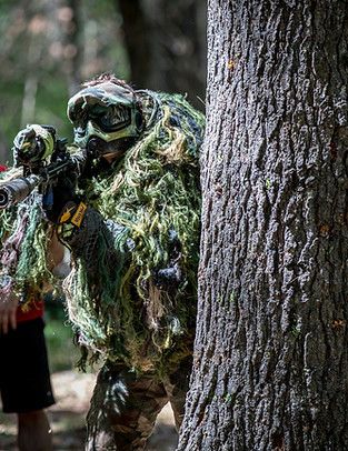 paintball-behind-tree