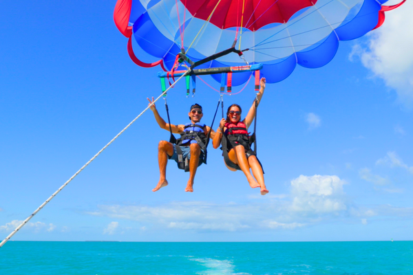 Parasailing - Downtown Seaport couple in air.png