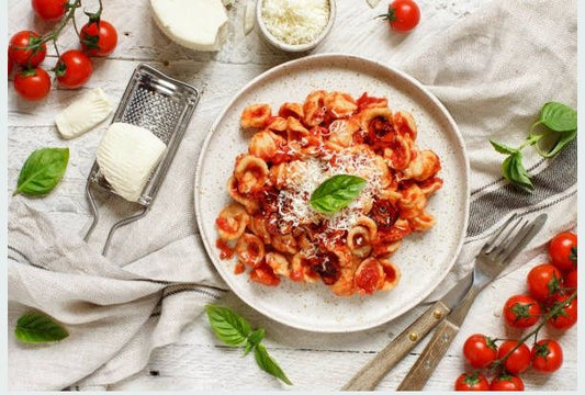 pasta with red sauce on white plate