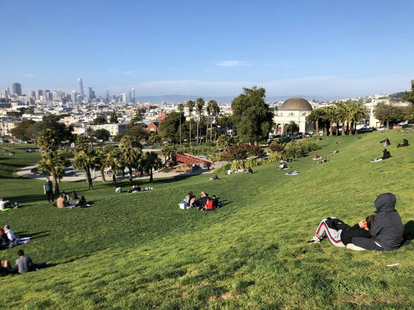 people hanging out on a hill