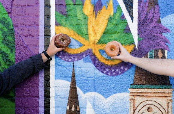 people-holding-up-donuts-jpg