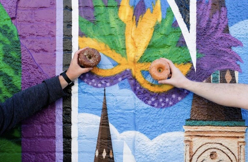 people-holding-up-donuts-jpg