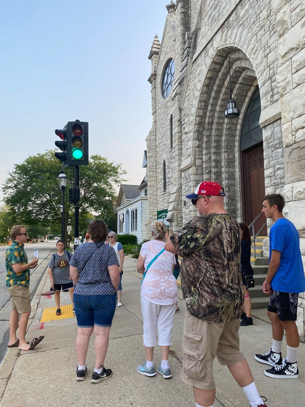 people on a tour by stoplight