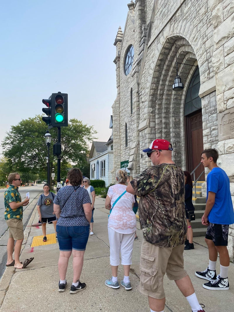 people on a tour by stoplight