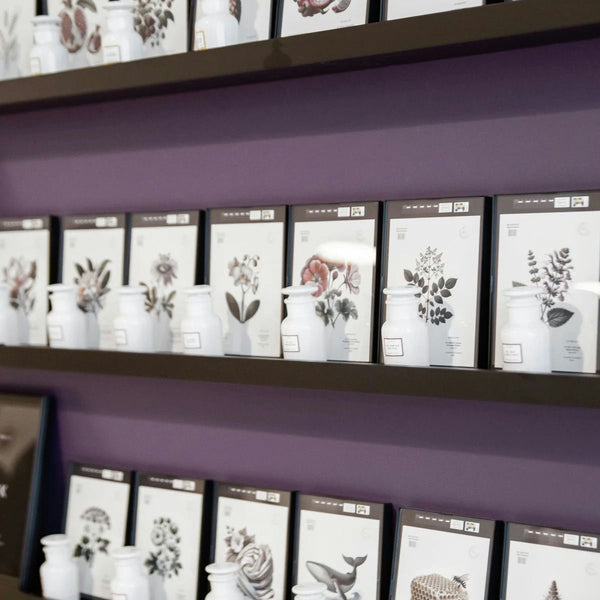 woman comparing scents for perfume