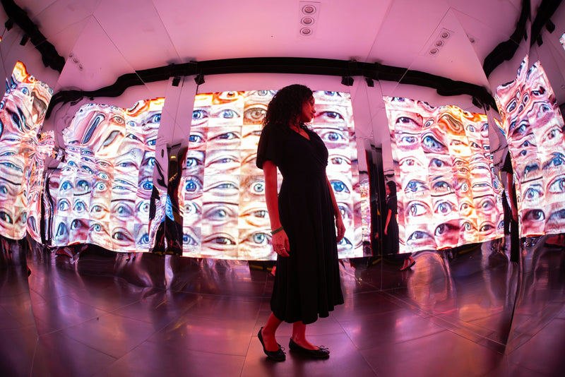 person in exhibit of eyes