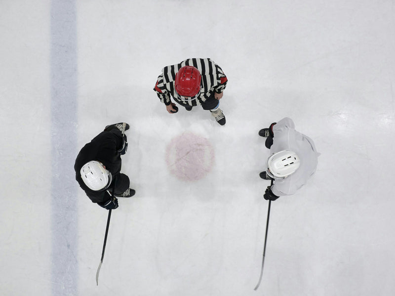 hockey players about to do coin flip