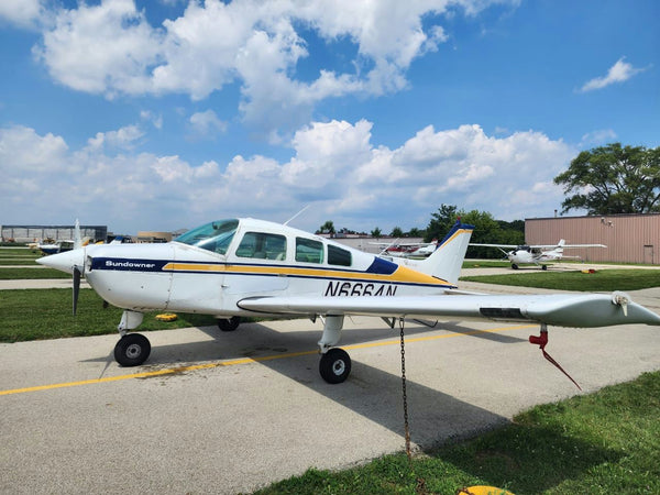 plane parked on sunny day