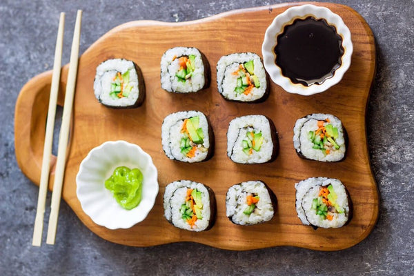Plated sushi with wasabi and soy suace