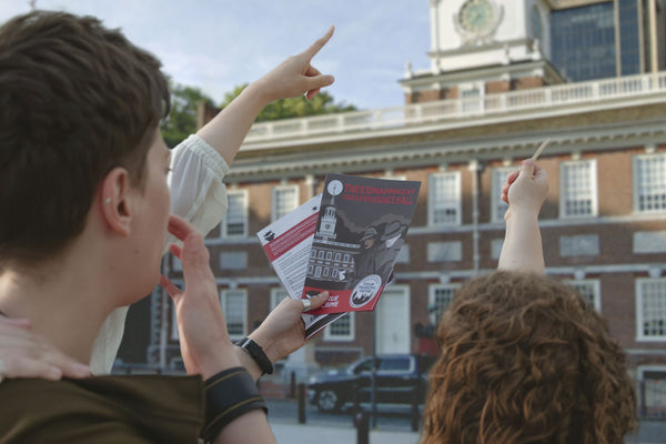 hand holding booklet in philly
