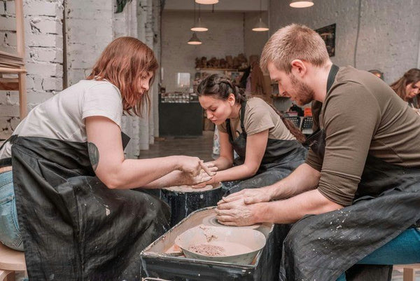 happy women with pottery