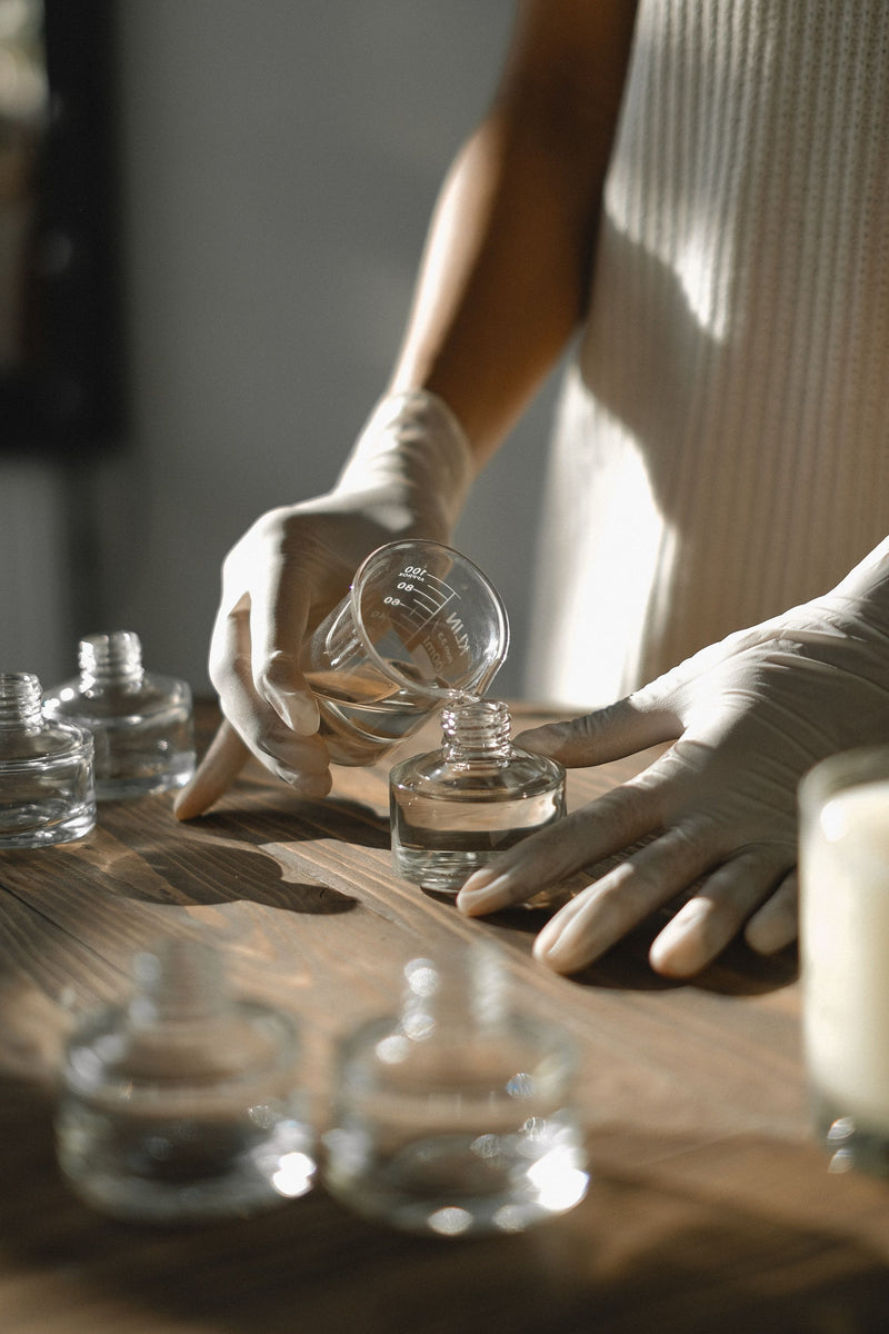 pouring-perfume-into-bottles