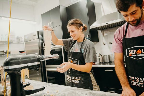 putting-dough-through-pasta-maker