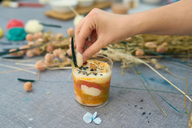 putting dried flower in candles (2).jpg