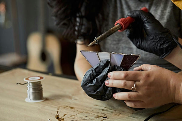 putting pieces of glass together