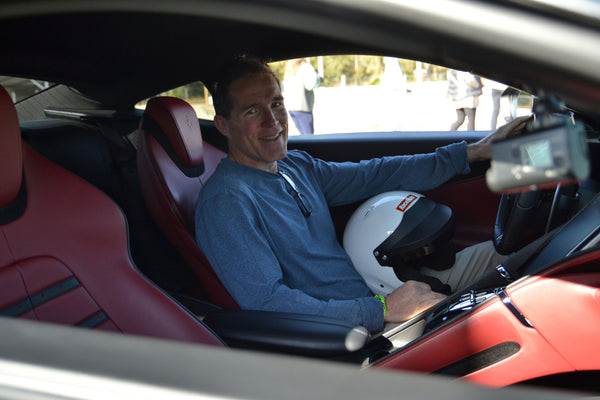 red sports car and man