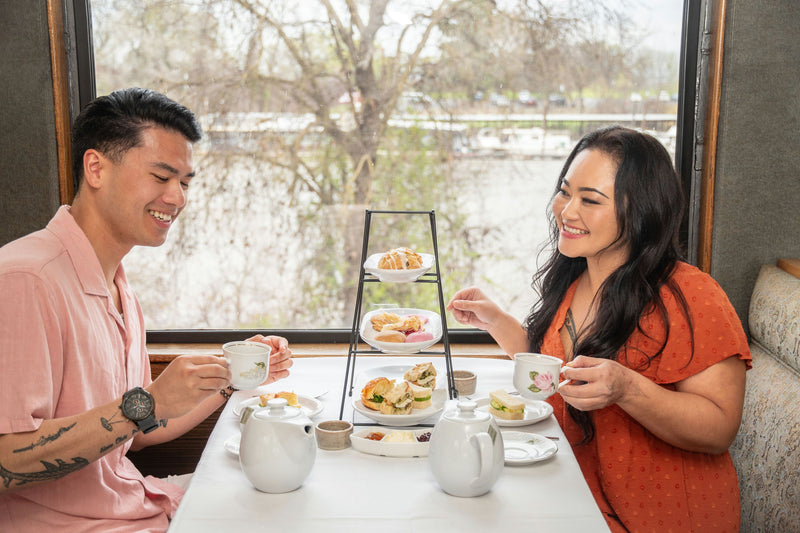 couple having tea on train