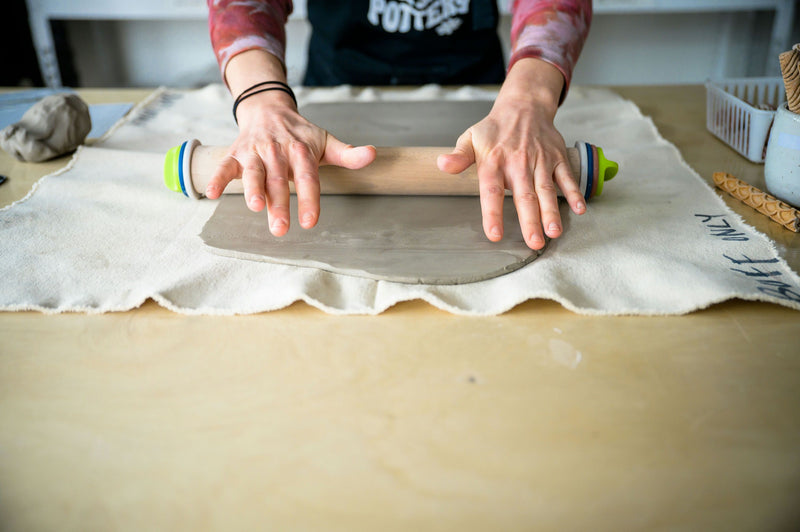 Rolling out pottery clay