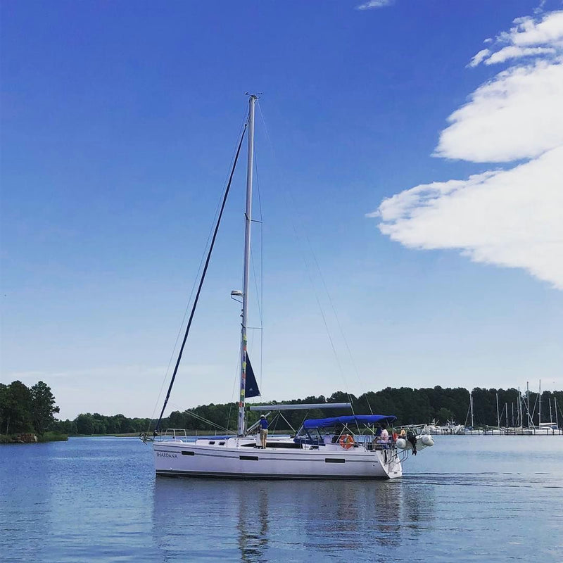 sailboat anchored in bay