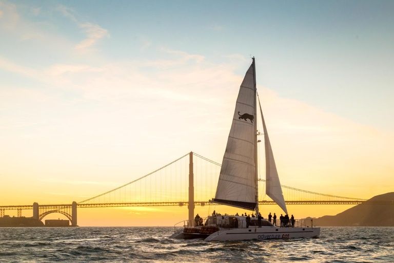 sailboat-in-the-sunset-with-bridge-in-background