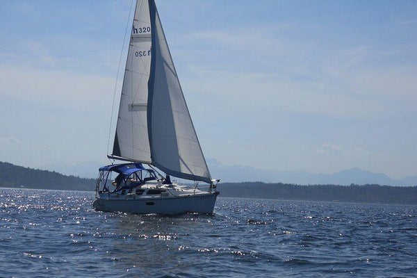 sailboat-on-water-in-the-distance