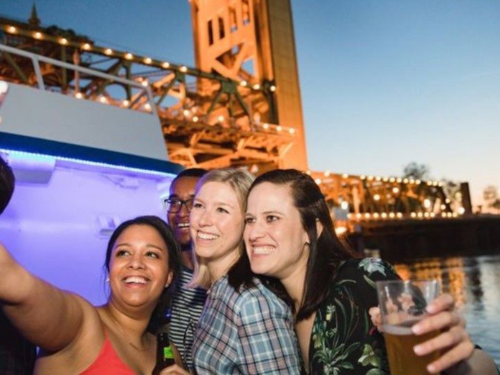 selfie-on-a-boat-under-a-bridge
