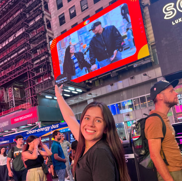 selfie-under-billboard-playing-video