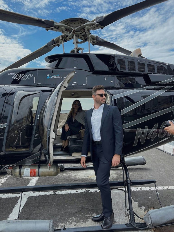 sharp dressed man getting on a helicopter.jpg