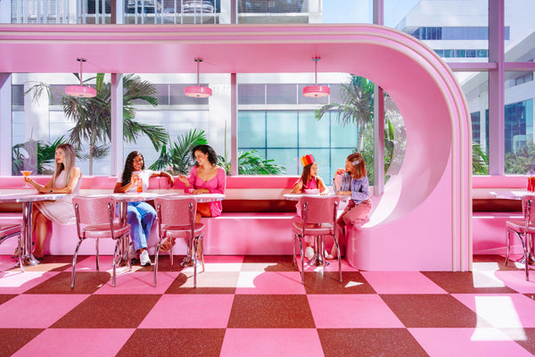 sitting in pink diner
