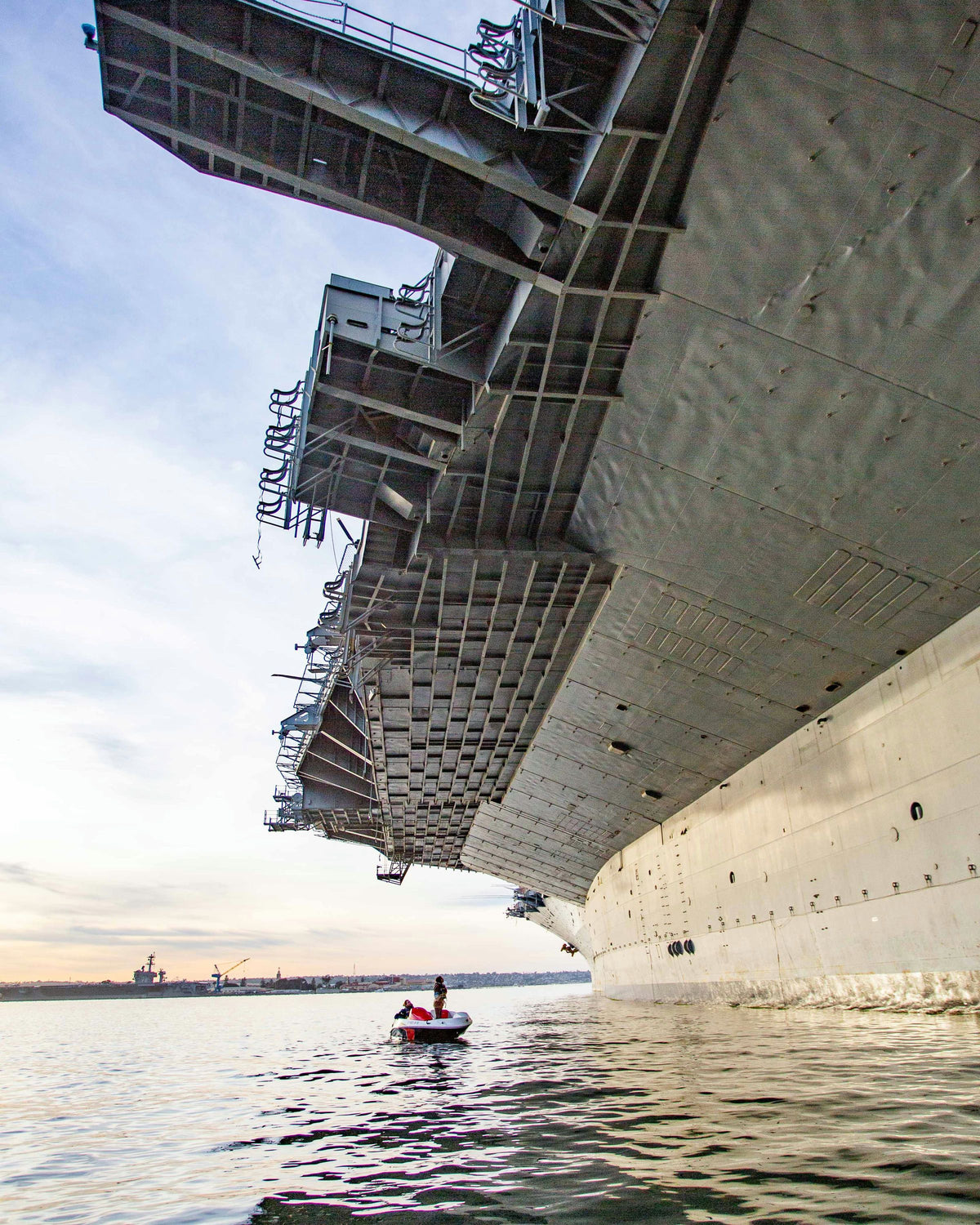small-boat-next-to-large-ship