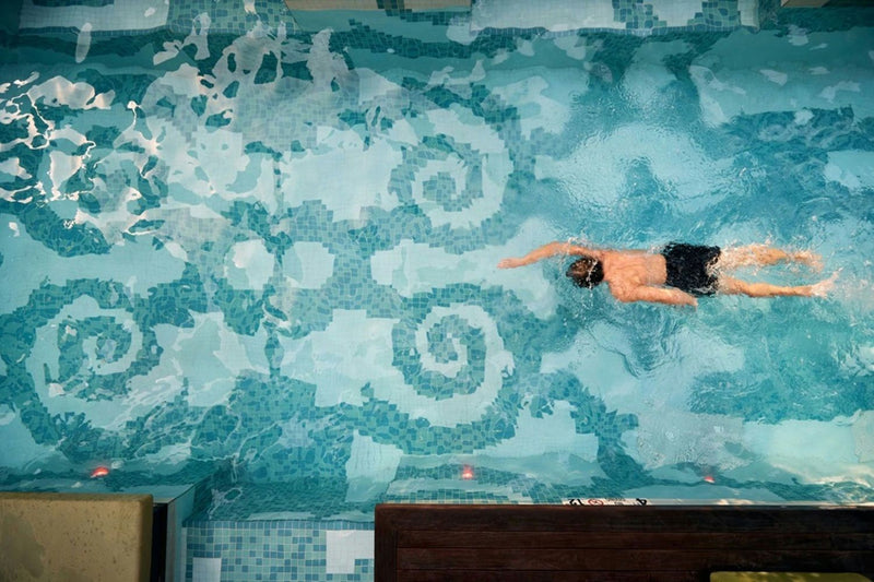 spa-wellness-and-pool-pass-w-hotel-philadelphia-mosaic-pool-swimmer-hero-view.jpg