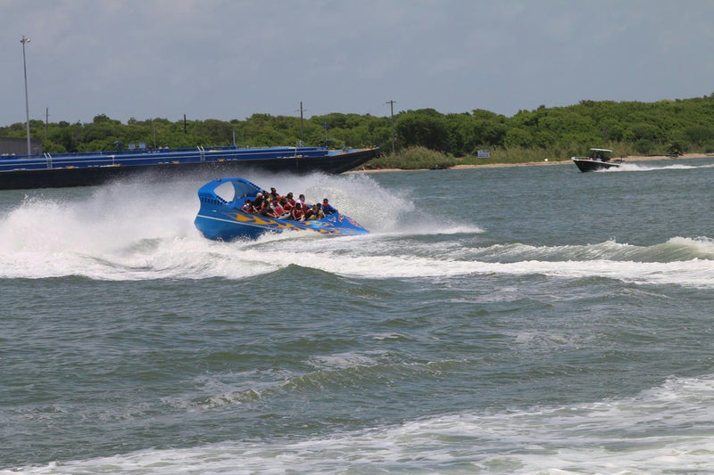 speedboat-taking-on-waves-jpg