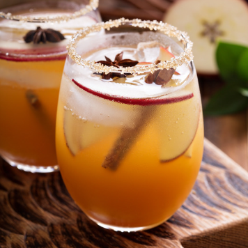 Woman with drink from drink making kit.png