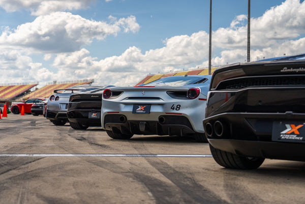 black and red car racing on track