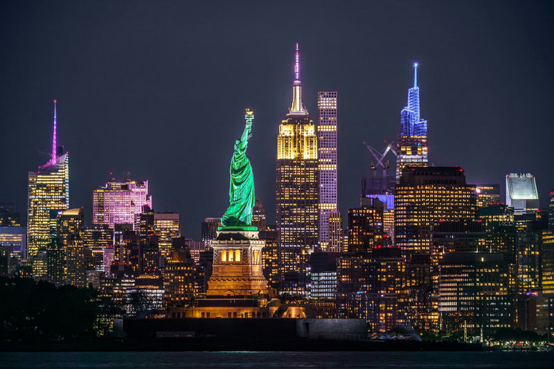 statue of liberty lit at night.jpg
