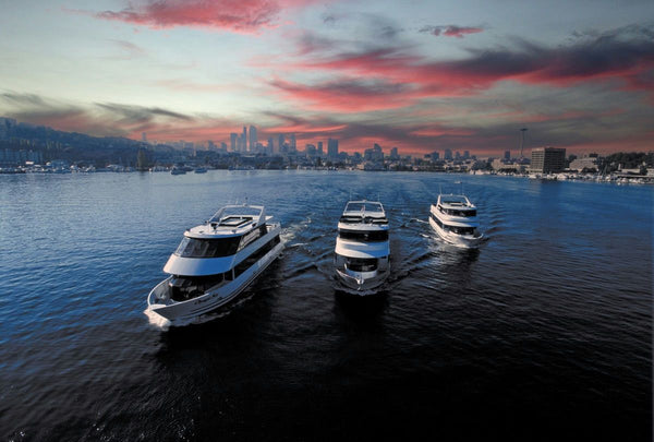 sunset with three yachts cruising