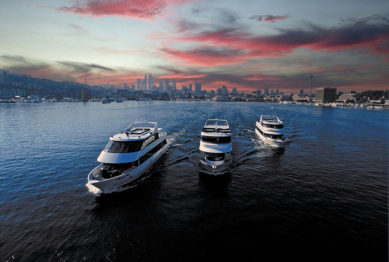 sunset with three yachts cruising